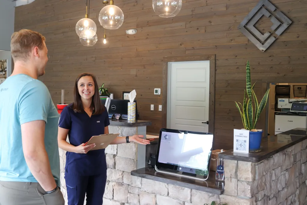 Welcoming front desk at chiropractic office.