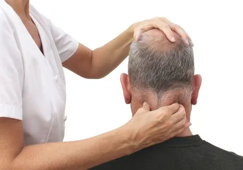 Chiropractor treating head and neck pain.