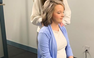 Woman receiving chiropractic care for neck pain