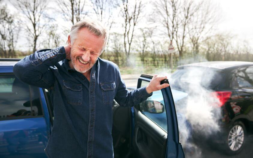 Man experiencing neck pain after a car accident