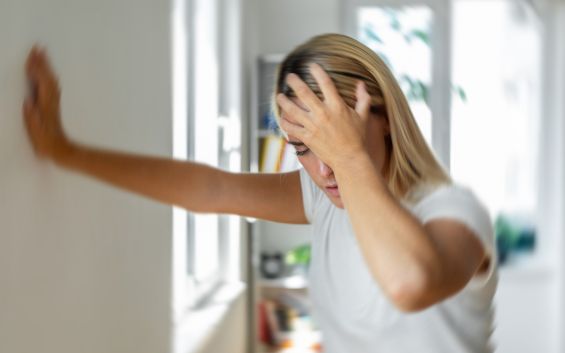 Woman struggling with vertigo